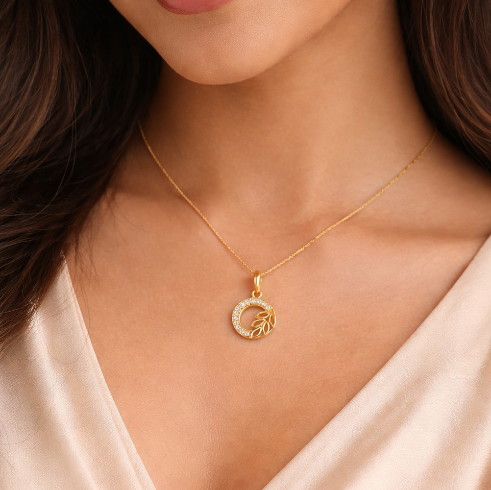 Elegant Gold Circular Leaf Pendant with Stone Detailing
